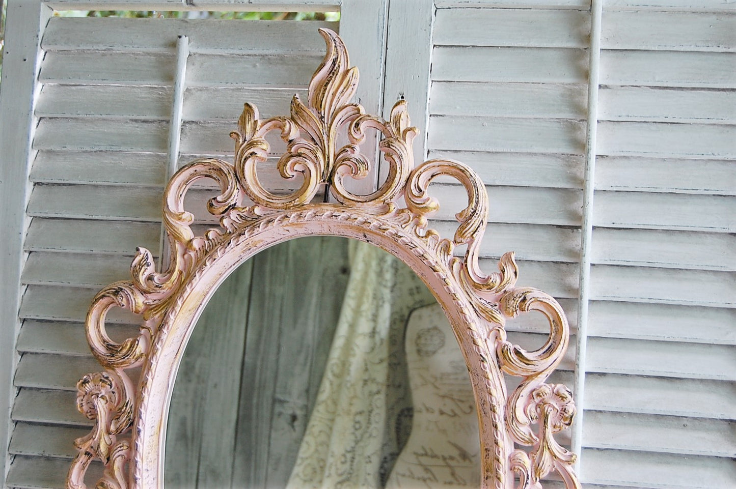 Ornate pink mirror