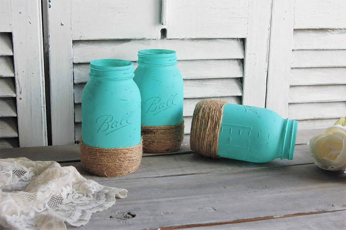 Aqua mason jars wrapped with jute