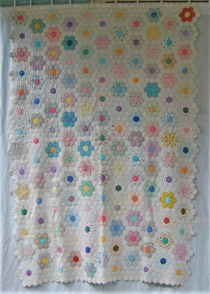Vintage grandmother's flower garden quilt