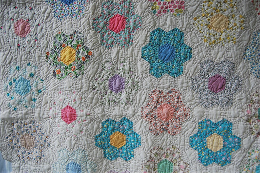 Vintage grandmother's flower garden quilt